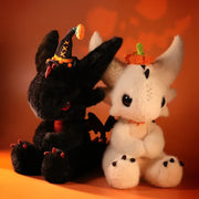 Two plush Dragon Boo Halloween Limited collector's toys, a black and a white dragon, each with festive accessories.