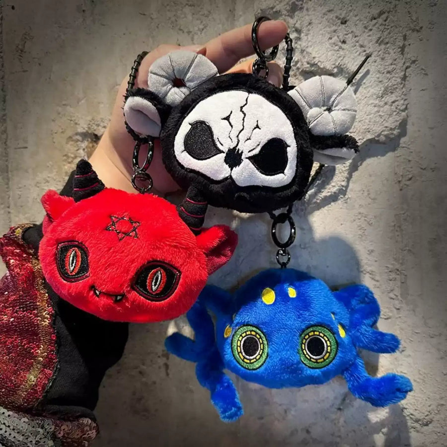 Dark Envoy Plush Charm Buu Evil collection featuring cute plush designs including a red devil, skull, and blue spider.
