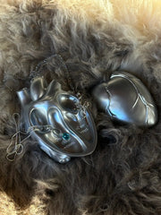 Vintage Heart Trinket Box displayed on soft fur, showcasing its unique design and intricate detailed finish.