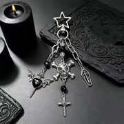 Gothic Skull and Cross Bag Charm featuring skull, cross, and bat designs on a dark, textured background.