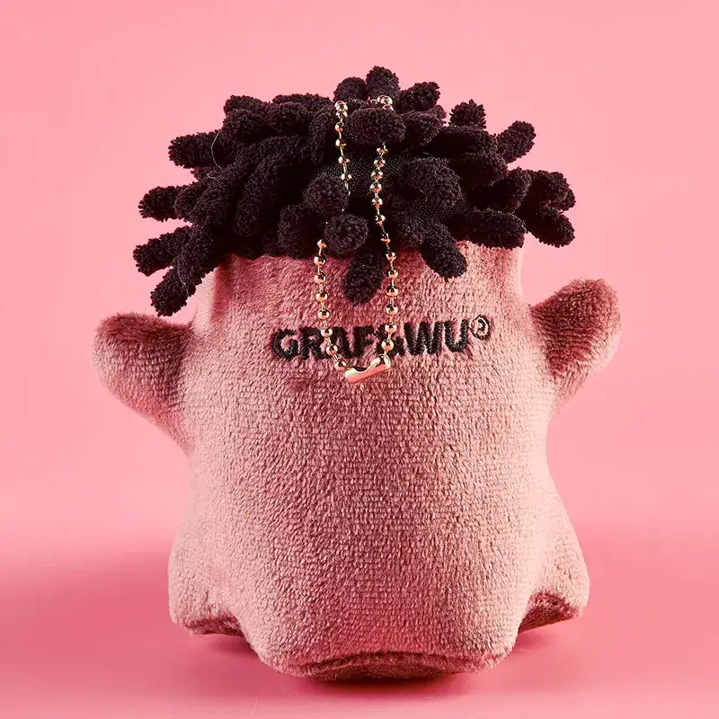 Monster Crew Plush Bag Charm with round shape and soft plush texture, perfect spooky accessory.