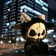Dark Envoy Reaper Plush - Buu Evil figure against a city backdrop at night, showcasing its cute design.