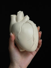 Vintage Heart Trinket Box held in a hand, featuring a detailed sculpted heart form in a soft matte finish.