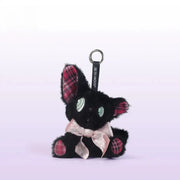 Listening black cat plush toy with green eyes and pink bow, perfect as a charming gift.