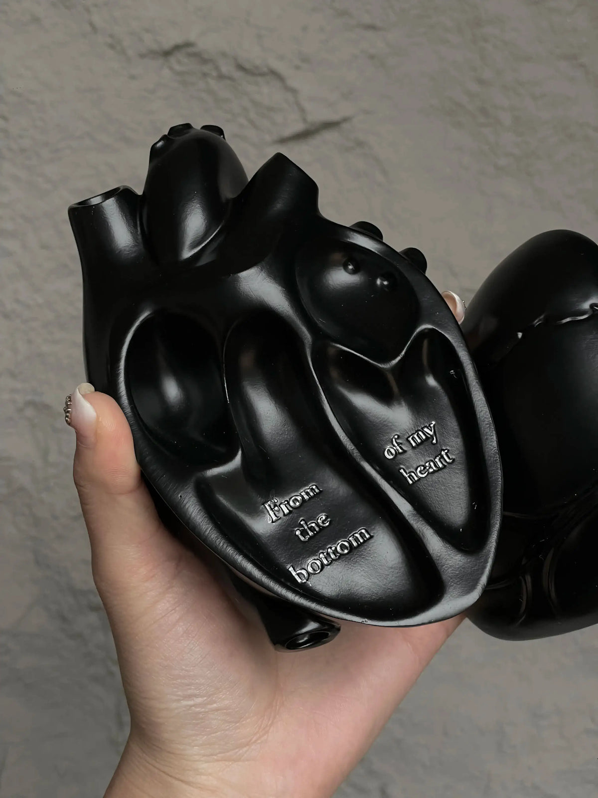 Vintage Heart Trinket Box held in hand, showcasing intricate anatomical heart design and engraved message.