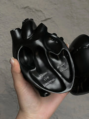 Vintage Heart Trinket Box held in hand, showcasing intricate anatomical heart design and engraved message.