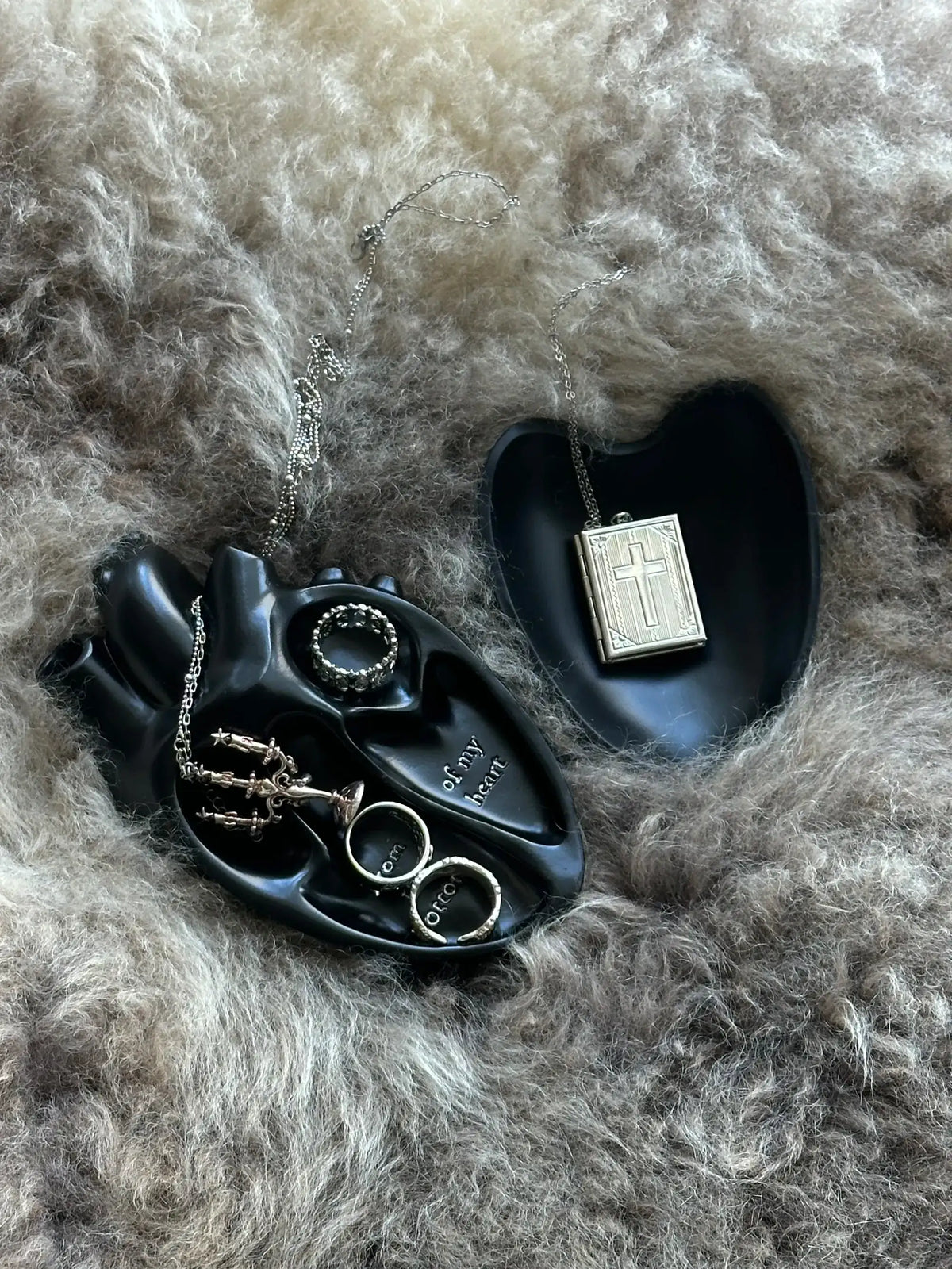 Vintage Heart Trinket Box holding jewelry and decorative items on a soft fur background.