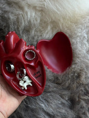 Vintage Heart Trinket Box opened, displaying rings and figurines inside a sculpted heart design.