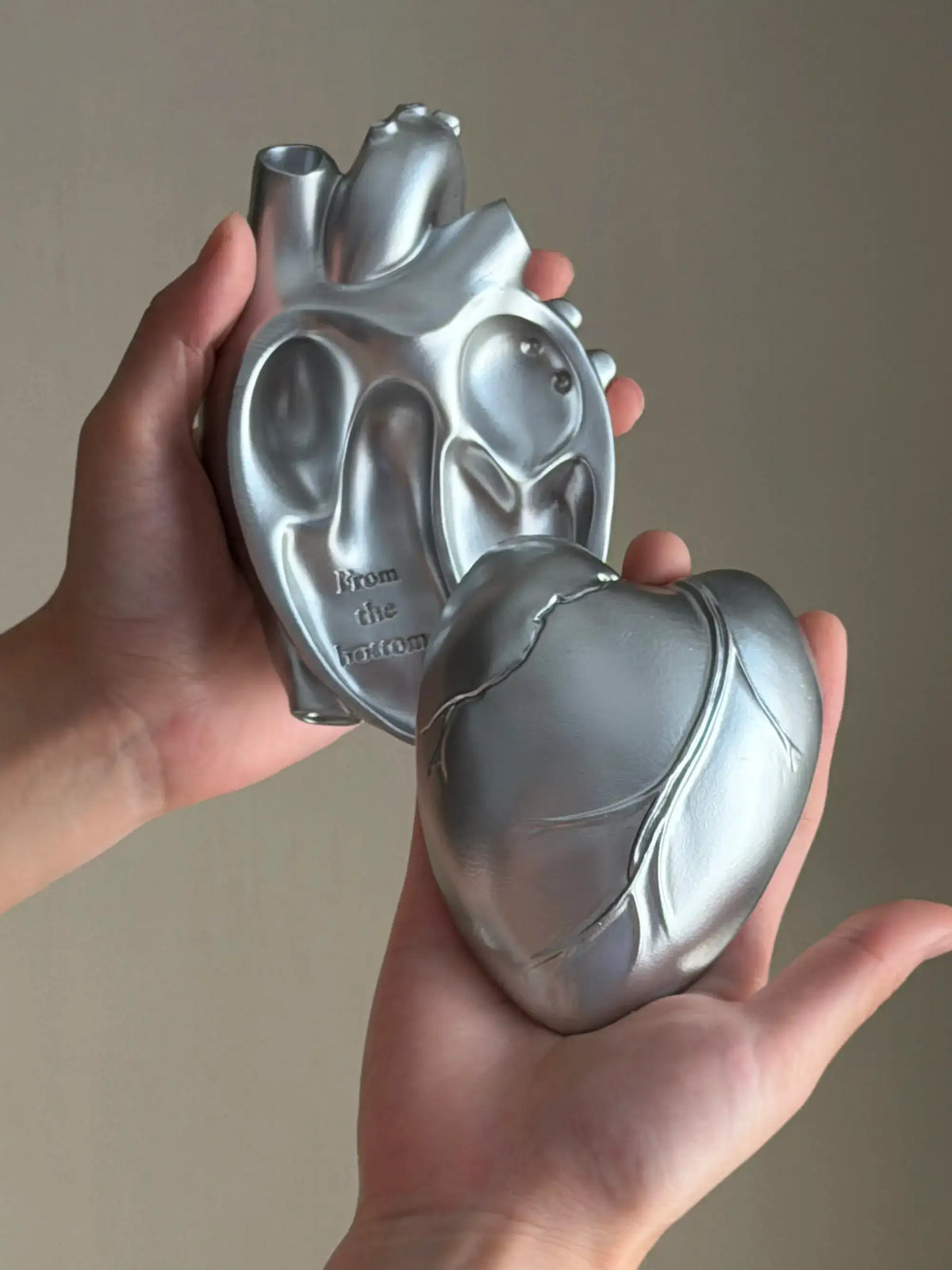 Vintage Heart Trinket Box held in hands, showcasing unique anatomical heart design in silver finish.