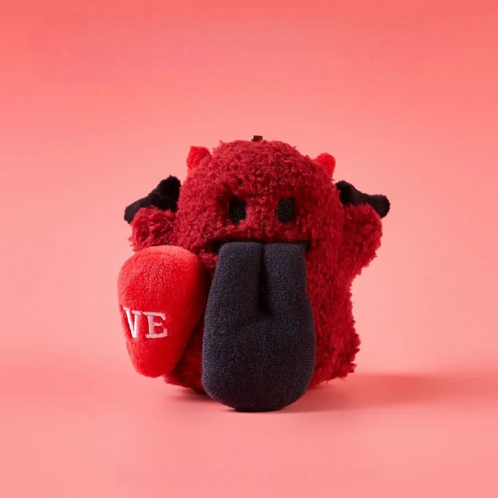 Magnetic angel and devil plush charms featuring a cute devil character with a tongue out holding a heart.