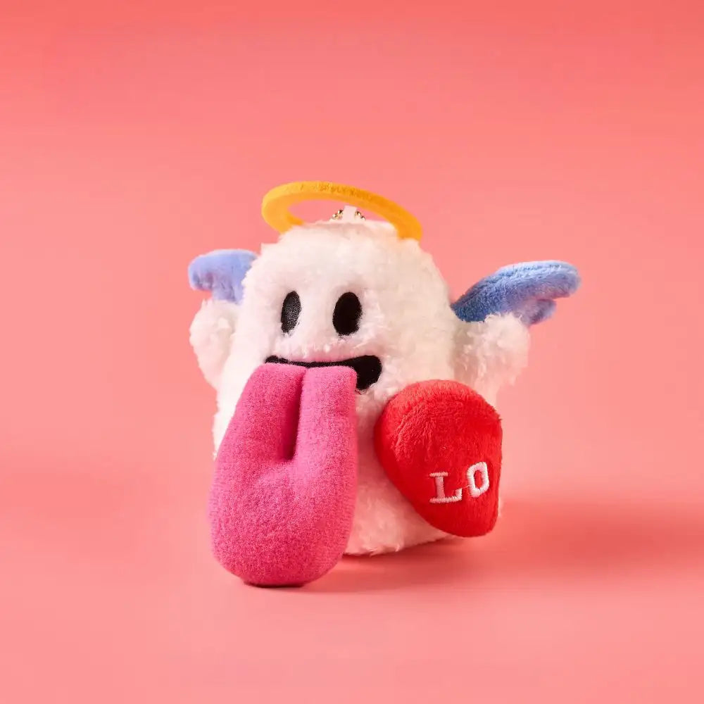 Magnetic angel and devil plush charms displaying the angel charm with a heart and a tongue sticking out.