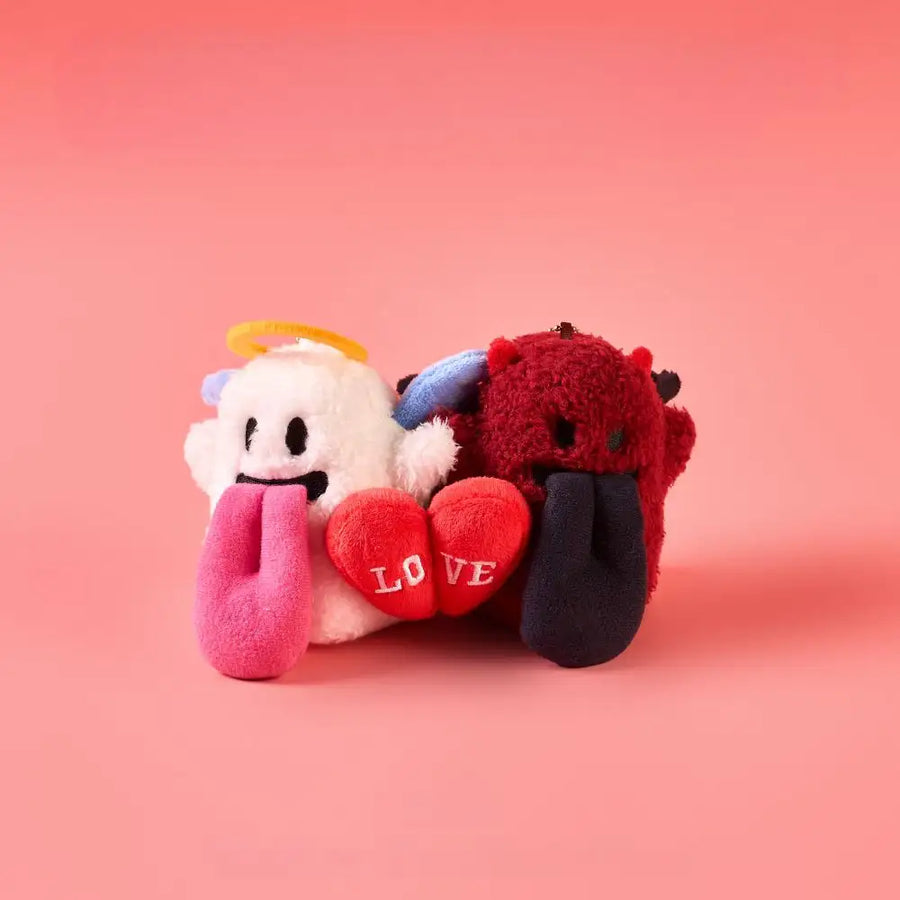 Magnetic angel and devil plush charms snapping together with hearts