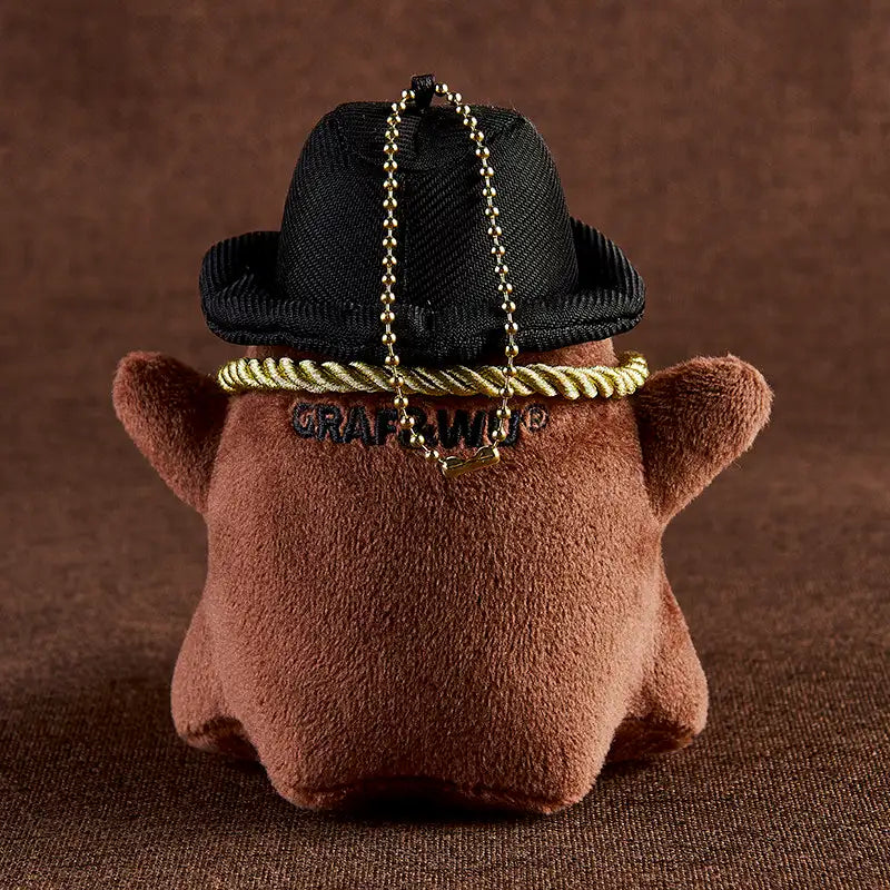 Monster Crew Plush Bag Charm featuring a cute round shape and black hat, perfect for adding whimsy to bags.