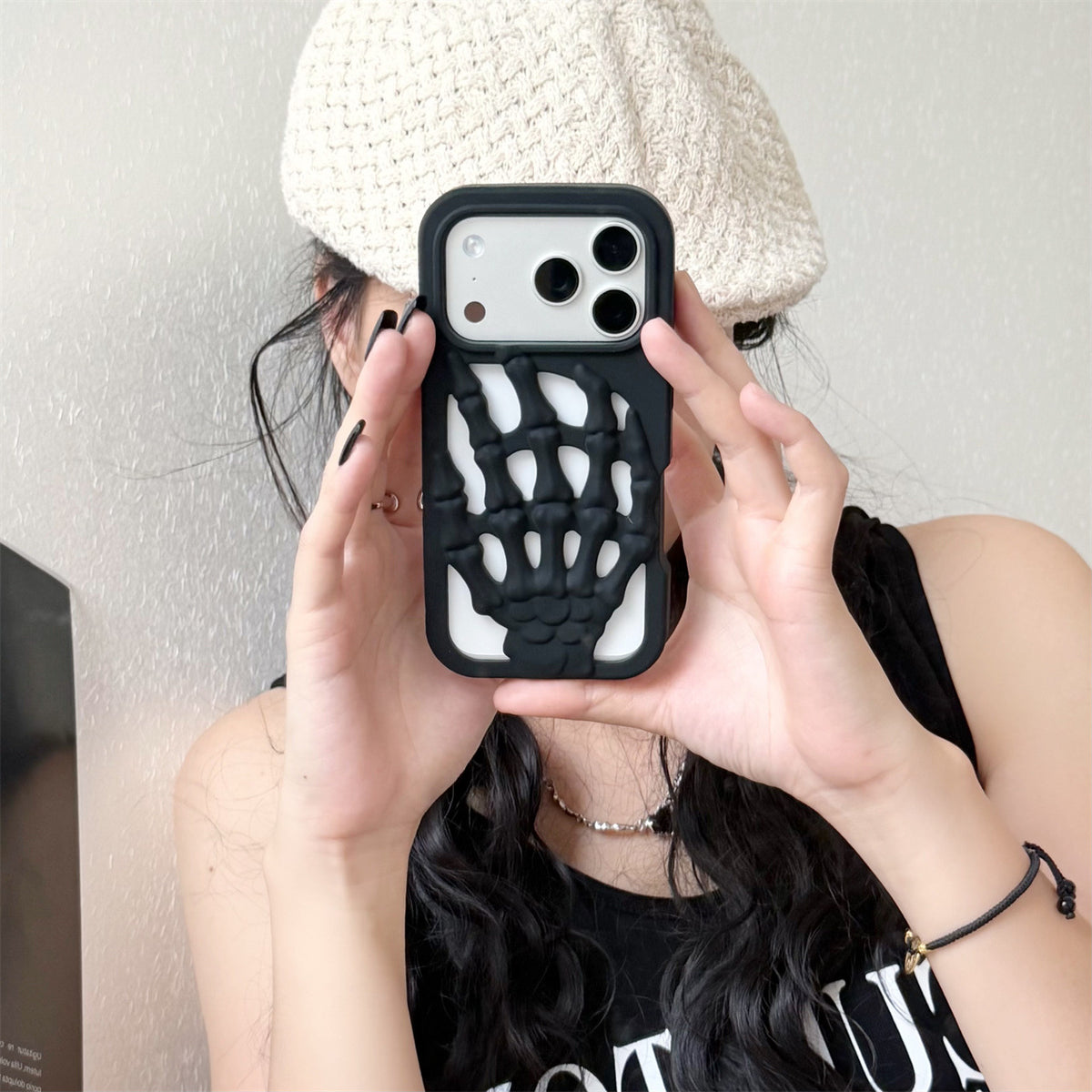 3D Skeleton Hand Gothic Phone Cover held by a person showcasing its unique skeletal design and artistic flair.