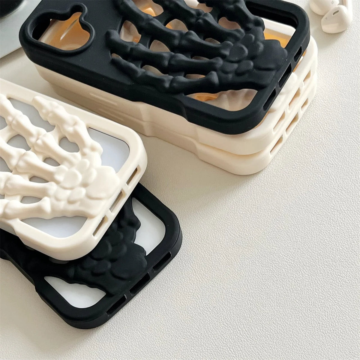 3D Skeleton Hand Gothic Phone Cover showcasing sculpted skeletal designs on black and white phone cases.