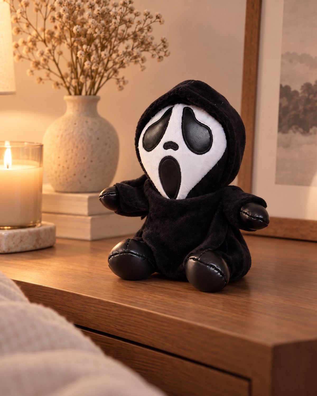 Gloomy Oddboo Buu Evil plush toy sitting on a wooden table with cozy decor, perfect for spooky nights.