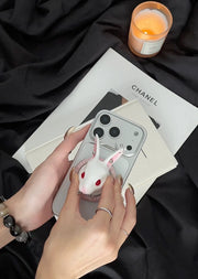Angry Bunny MagSafe Phone Stand on a smartphone, showcasing its stylish wax-white rabbit design and hands-free functionality.