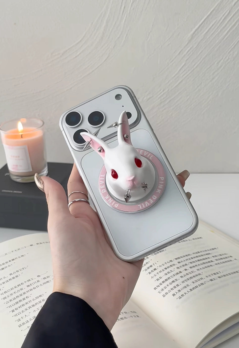 Angry Bunny MagSafe Phone Stand showcasing a unique wax-white bunny design on a smartphone, adding stylish functionality.