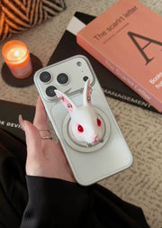 Angry Bunny MagSafe Phone Stand on a smartphone in hand, featuring a whimsical design with red eyes and a unique look.