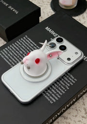 Angry Bunny MagSafe Phone Stand on a smartphone, showcasing its unique 3D-printed rabbit design and cute attitude.