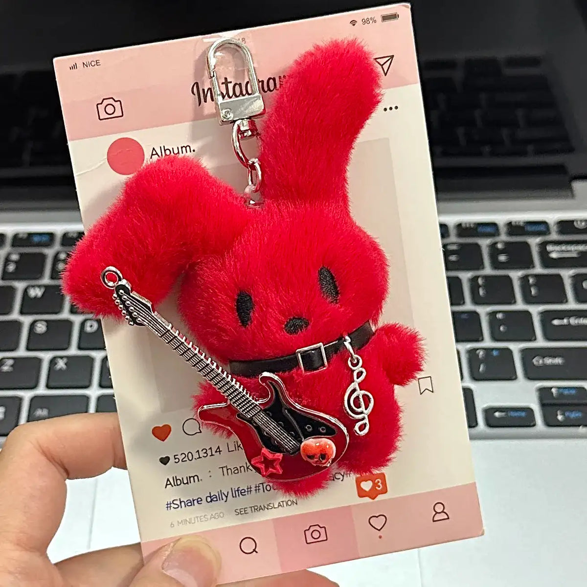 Guitarist Bunny Plush Charm with plush guitar on a card, great accessory for backpacks.