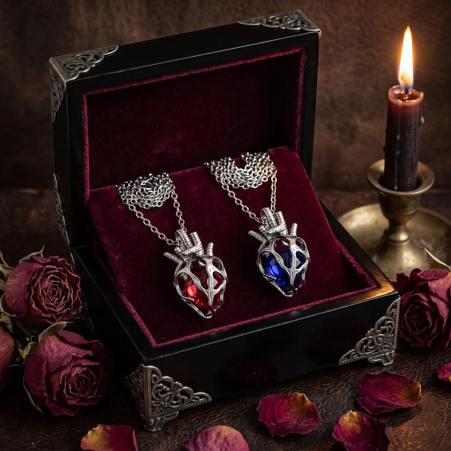 Soul Resonance Gothic Heart Necklace in a vintage box with a red and blue heart pendant.