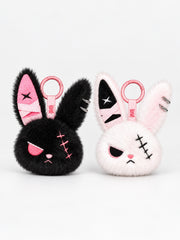 Cuddly bunny plush keychain in black and pink, featuring cute designs with distinctive stitched details.