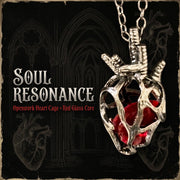 Soul Resonance Gothic Heart Necklace featuring openwork heart cage with red glass core.