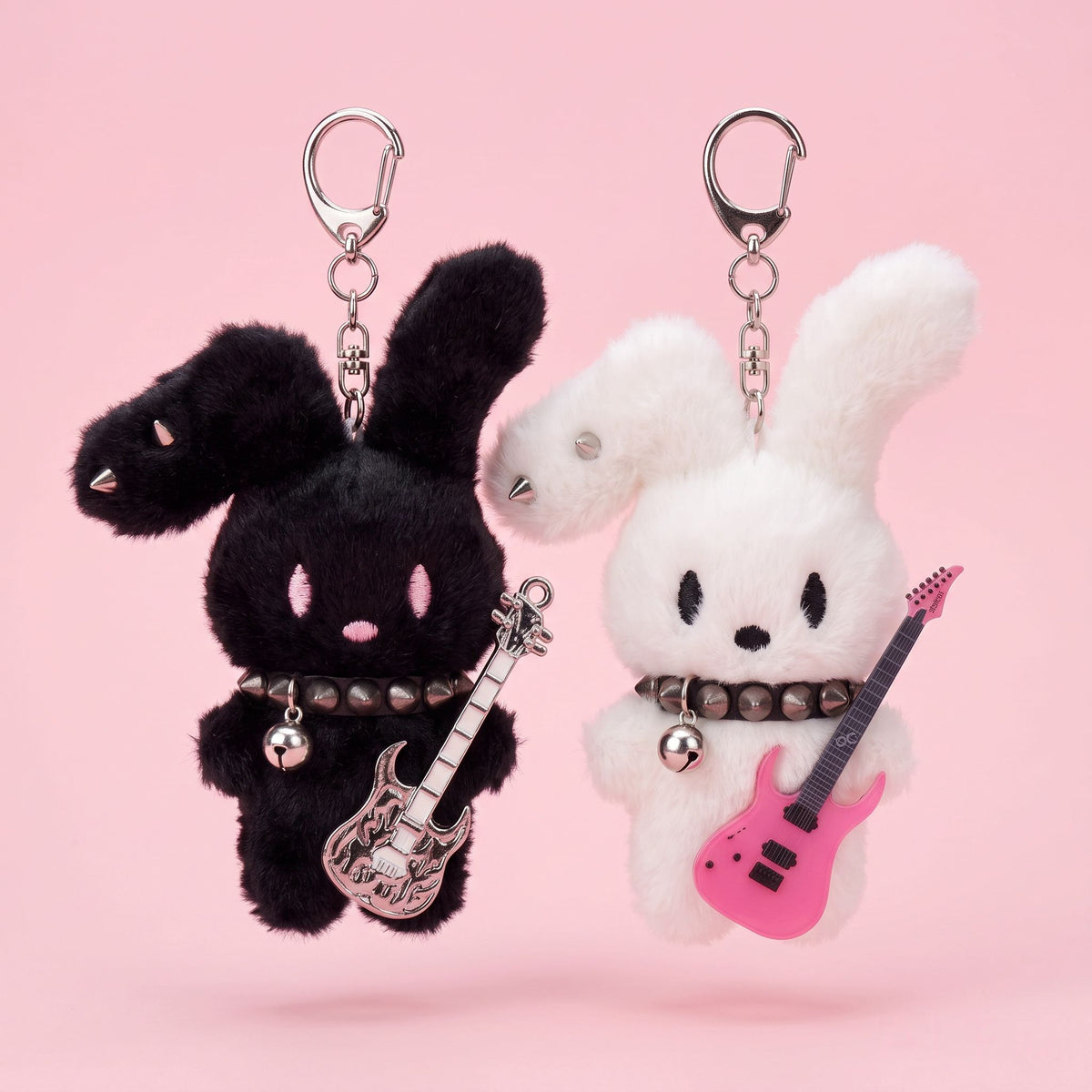 Guitarist Bunny Plush Charm featuring a black and a white bunny with guitars, perfect for accessorizing backpacks.