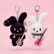 Guitarist Bunny Plush Charm featuring a black and a white bunny with guitars, perfect for accessorizing backpacks.