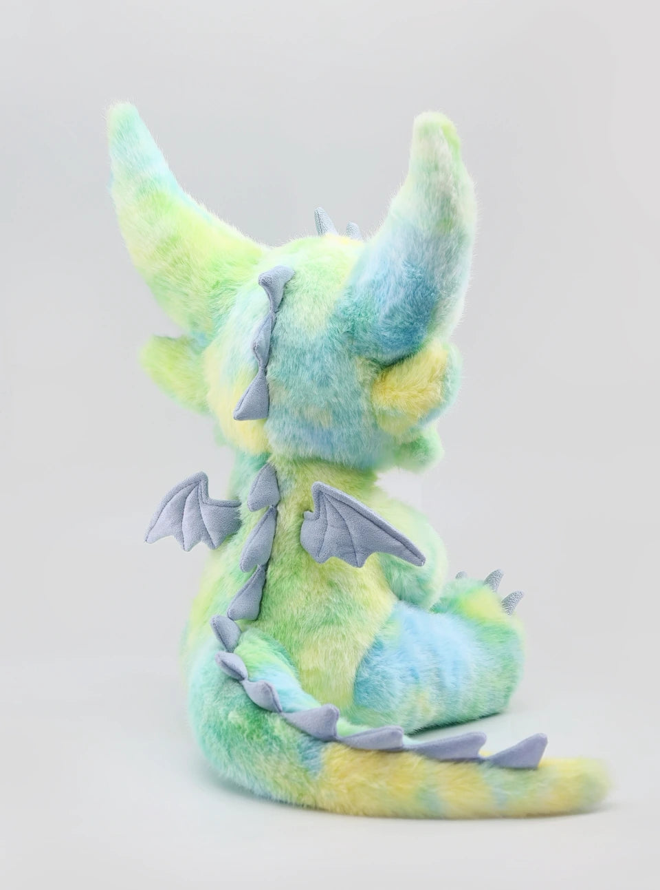 Stuffed dragon Boo plush toy in pastel colors, showcasing its detailed wings and fluffy texture, perfect for cuddling.