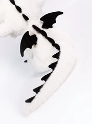 Stuffed dragon Boo plush tail with black wings and spine details, showcasing the limited edition design.