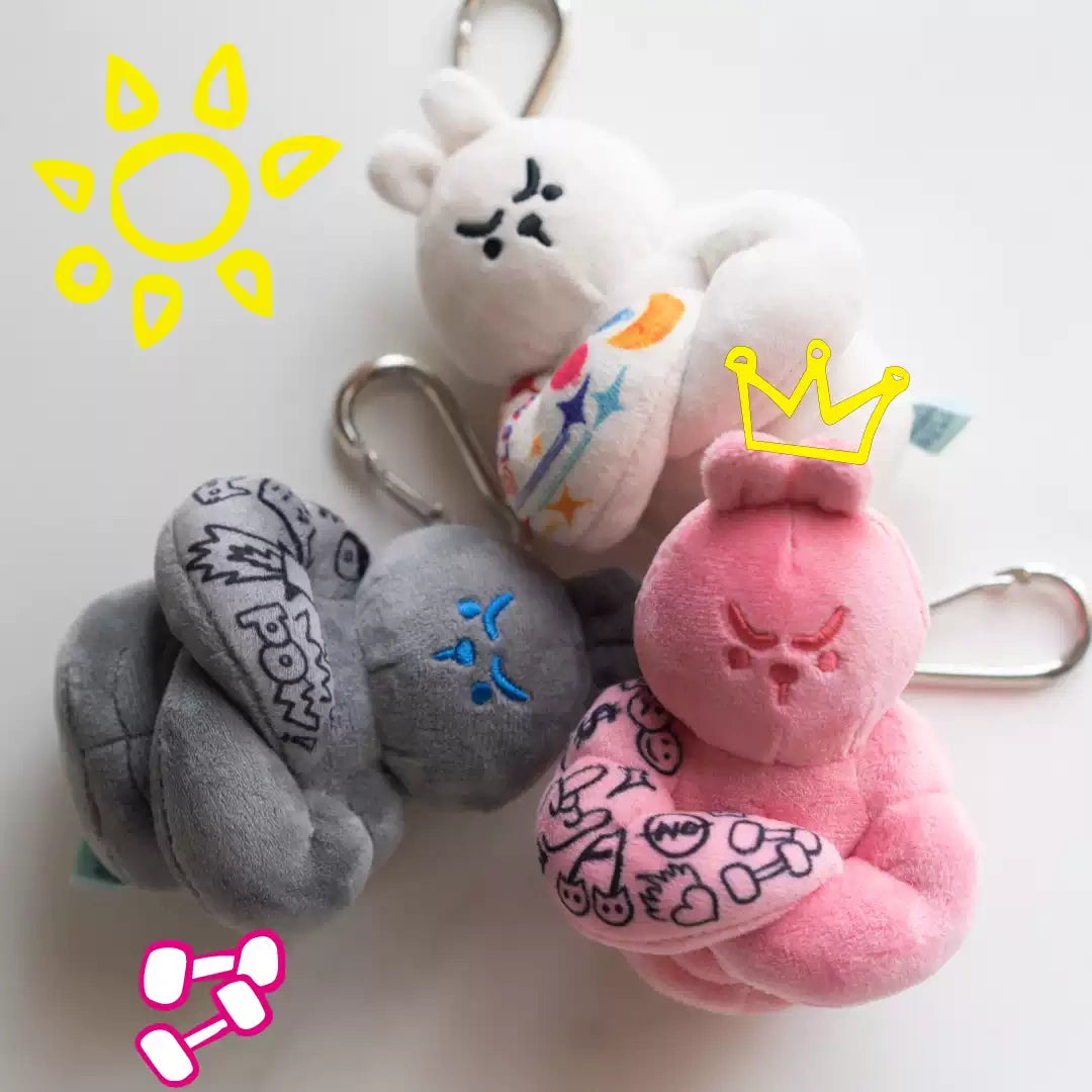 Bunny plush bag charm trio featuring gray, white, and pink bunnies with unique designs and soft textures.
