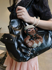 Buu Evil Plush Bag Charm attached to a stylish black purse, showcasing its cute design and playful gym-inspired details.