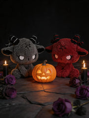 Dark Envoy Gothic Cute Plush Doll - Buu Evil in a spooky setting with a carved pumpkin, candles, and roses.