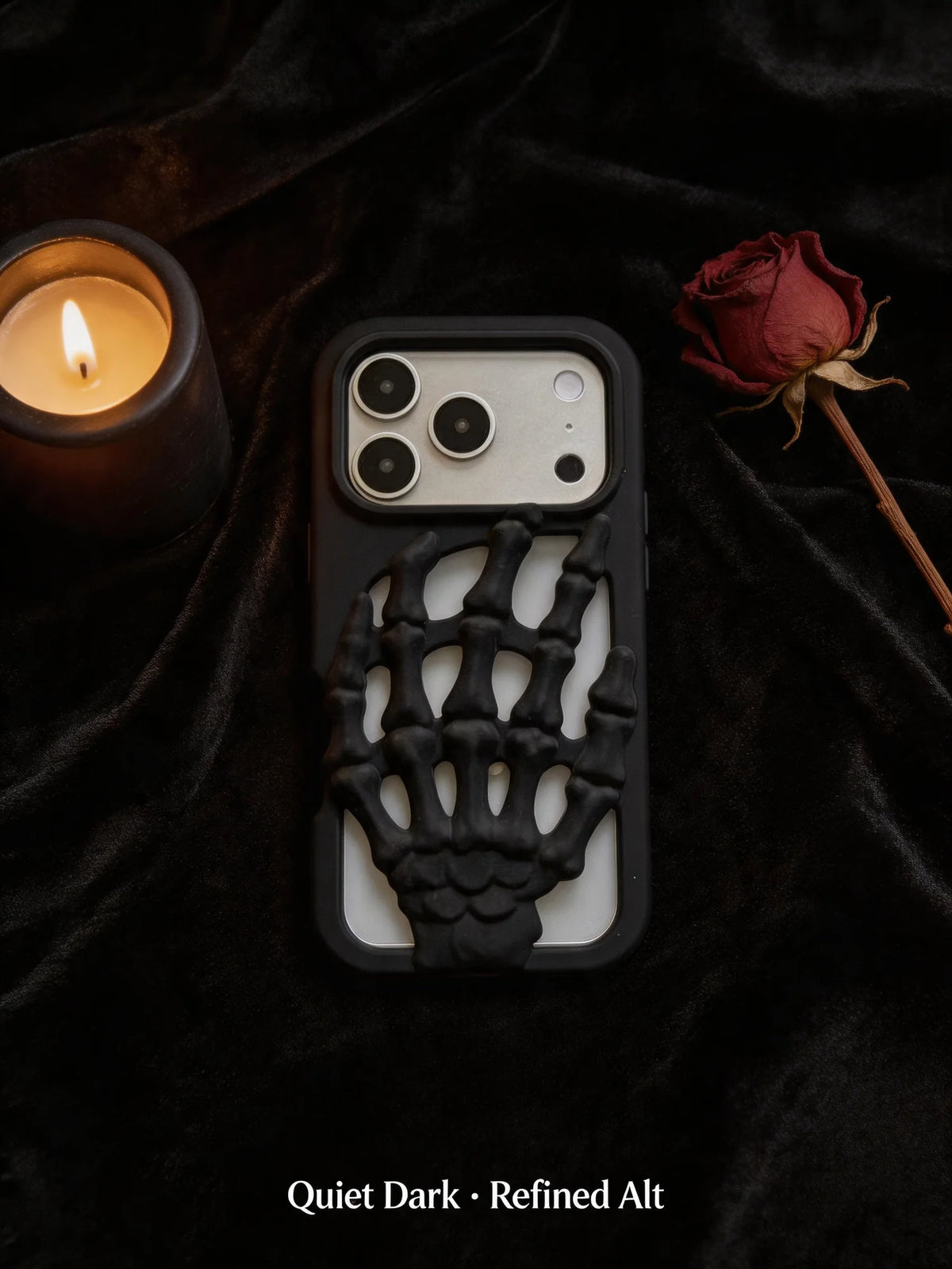 3D Skeleton Hand Gothic Phone Cover showcased on a dark fabric with a candle and rose.