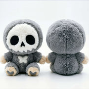 Little Angu plush charm hanging from a bag, showcasing its cute skull design and stitched features.
