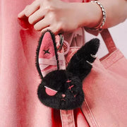 Cuddly Bunny - DarkCute BandaBun keychain attached to a pink bag, showcasing its soft plush design and playful features.