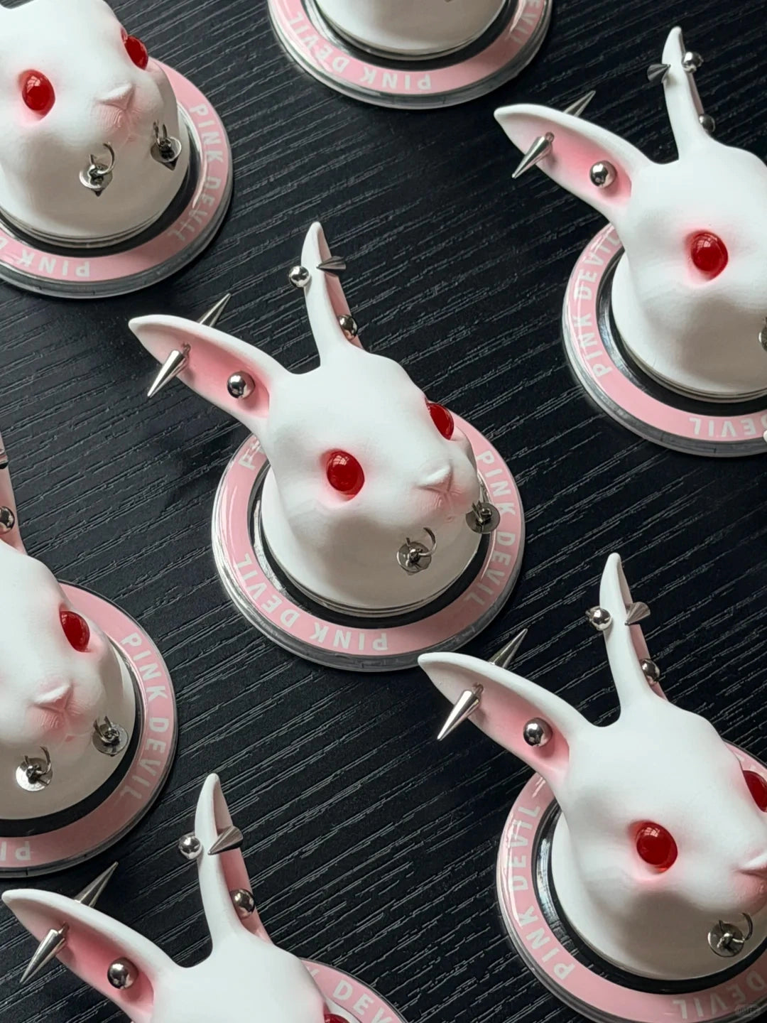 Angry Bunny MagSafe Phone Stand featuring a unique white rabbit design with spiked back and red eyes on a stylish phone holder.