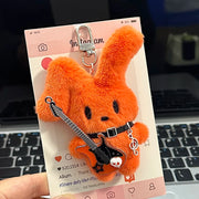 Guitarist Bunny Plush Charm with plush guitar on a social media card, perfect for stylish backpacks.