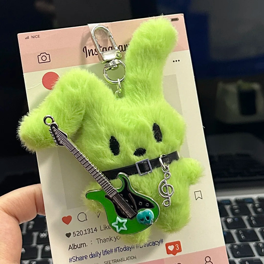 Guitarist Bunny Plush Charm with a plush guitar, perfect for accessorizing your backpack.